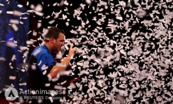 Darts - 2011 Ladbrokes.com World Darts Championship - Alexandra Palace, London - 3/1/11 Adrian Lewis celebrates with the trophy after winning the Final Mandatory Credit: Action Images / Steven Paston Livepic