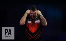 Michael Smith reacting during the walk on during day ten of the William Hill World Darts Championship at Alexandra Palace, London. PRESS ASSOCIATION Photo. Picture date: Saturday December 23, 2017. See PA story DARTS World. Photo credit should read: Steven Paston/PA Wire. RESTRICTIONS: Use subject to restrictions. Editorial use only. No commercial use.