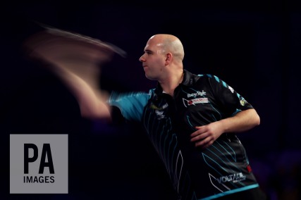 Rob Cross in action during day fourteen of the William Hill World Darts Championship at Alexandra Palace, London. PRESS ASSOCIATION Photo. Picture date: Saturday December 30, 2017. See PA story DARTS World. Photo credit should read: Steven Paston/PA Wire. RESTRICTIONS: Use subject to restrictions. Editorial use only. No commercial use.